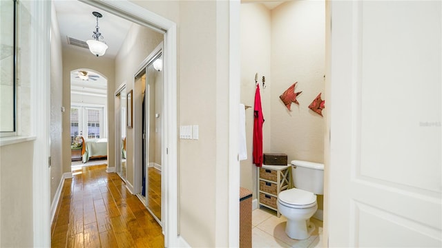 hallway with hardwood / wood-style floors