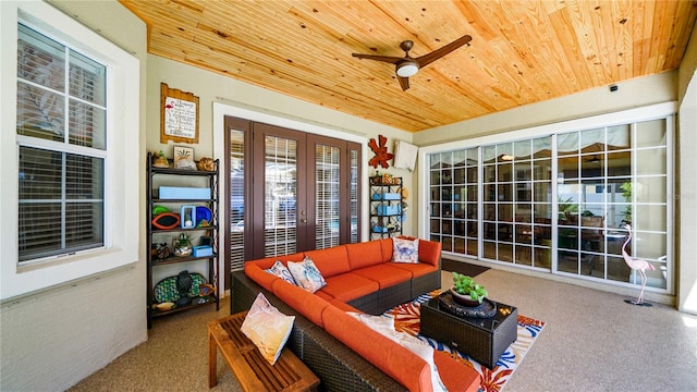 living room featuring wood ceiling, carpet, and ceiling fan