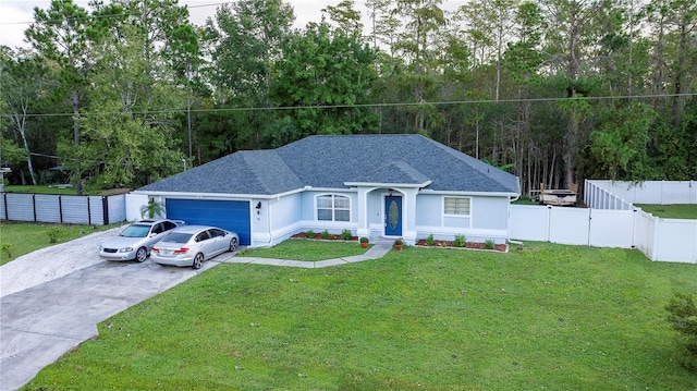 single story home featuring a garage and a front lawn