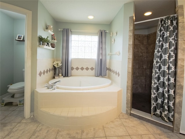 bathroom with independent shower and bath, toilet, and tile patterned floors