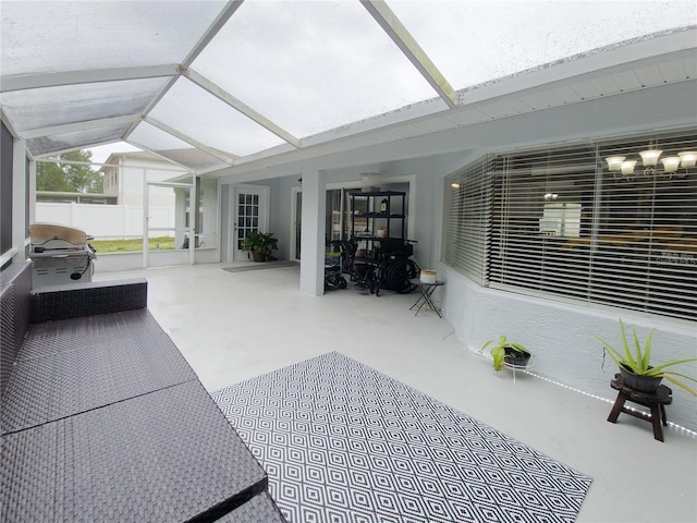 sunroom / solarium featuring vaulted ceiling