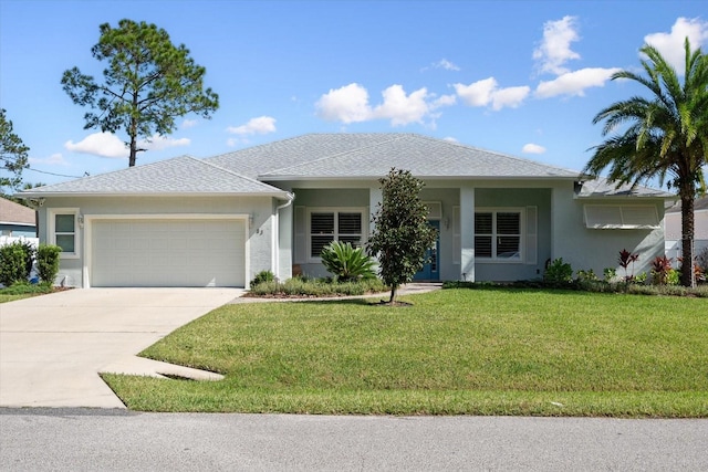 view of front of home featuring a front lawn and a garage