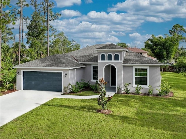 mediterranean / spanish-style home with a front lawn and a garage