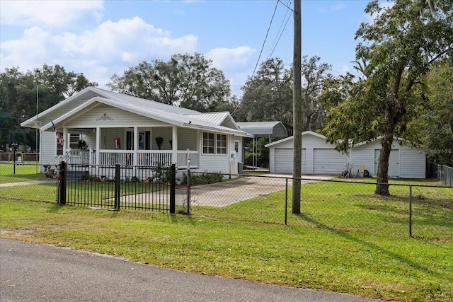 view of front of house with an outdoor structure, a front lawn, covered porch, and a garage