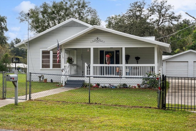 bungalow with an outdoor structure, a garage, a front lawn, and a porch