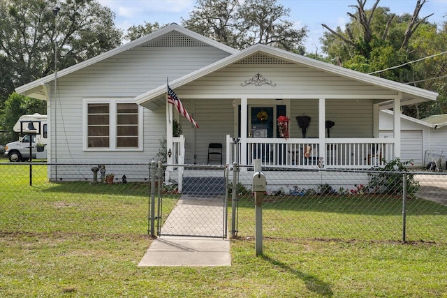 bungalow with a porch and a front yard