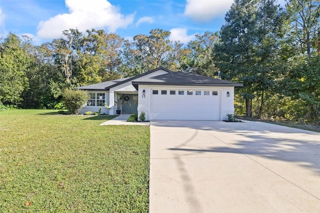 ranch-style home featuring a garage and a front lawn