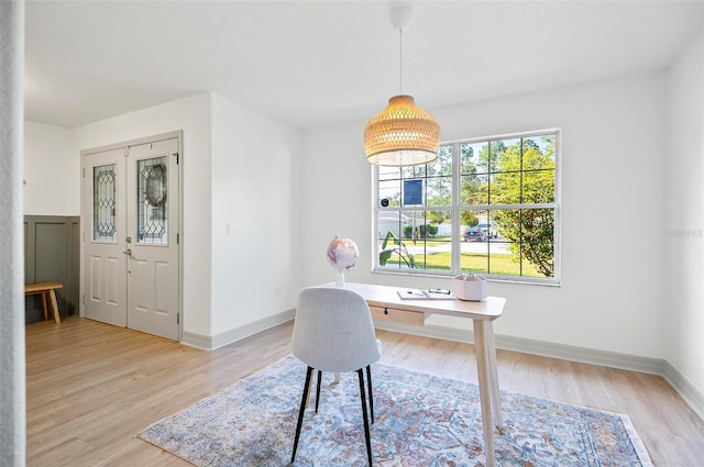 office with light hardwood / wood-style flooring