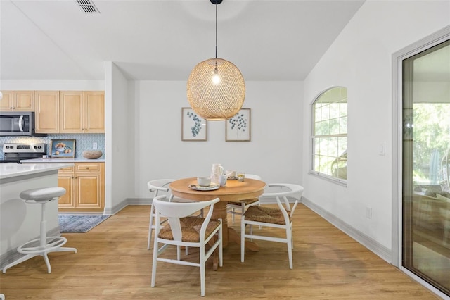 dining room featuring light hardwood / wood-style flooring