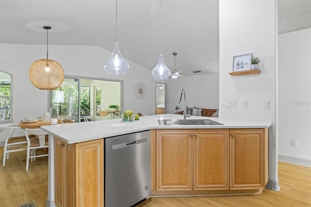 kitchen with lofted ceiling, sink, light wood-type flooring, stainless steel dishwasher, and ceiling fan