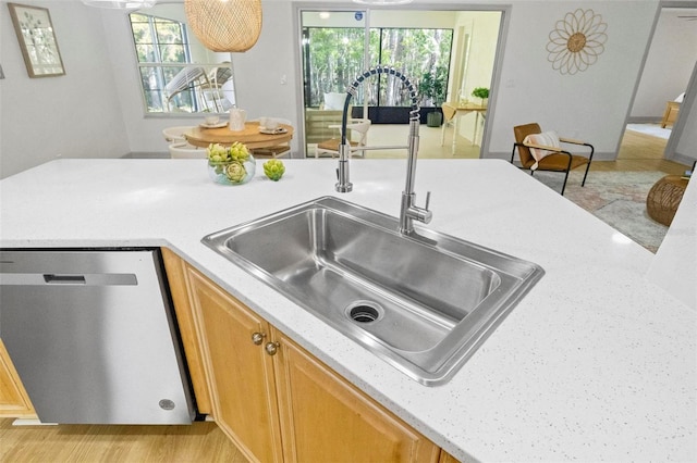 kitchen featuring sink, light hardwood / wood-style flooring, and dishwasher