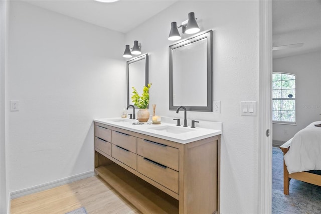 bathroom featuring vanity and hardwood / wood-style flooring