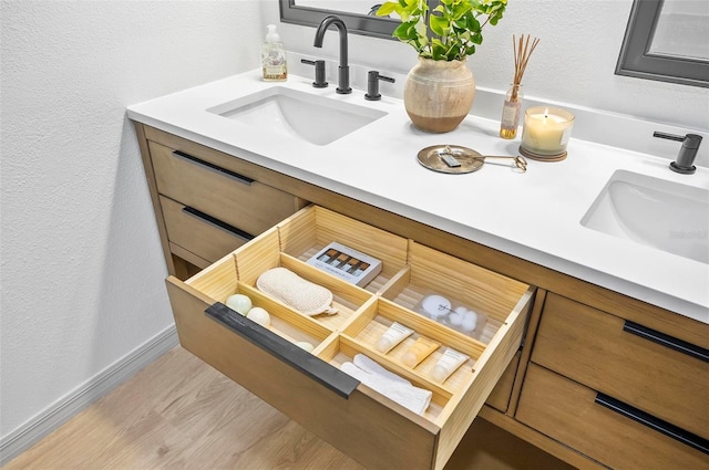 bathroom with vanity and hardwood / wood-style floors