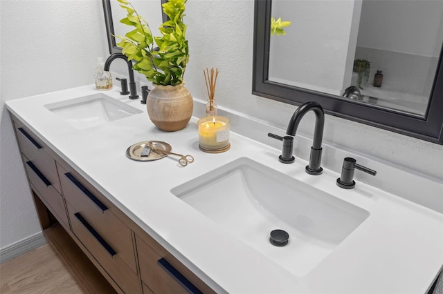 bathroom featuring vanity and hardwood / wood-style flooring