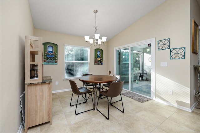 dining area with light tile patterned floors, an inviting chandelier, and lofted ceiling