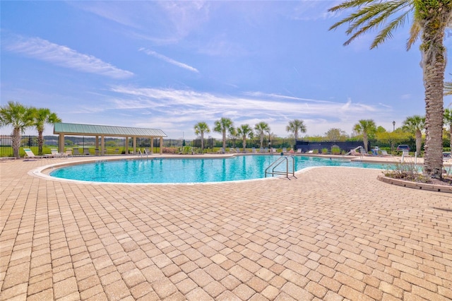 view of swimming pool featuring a patio area