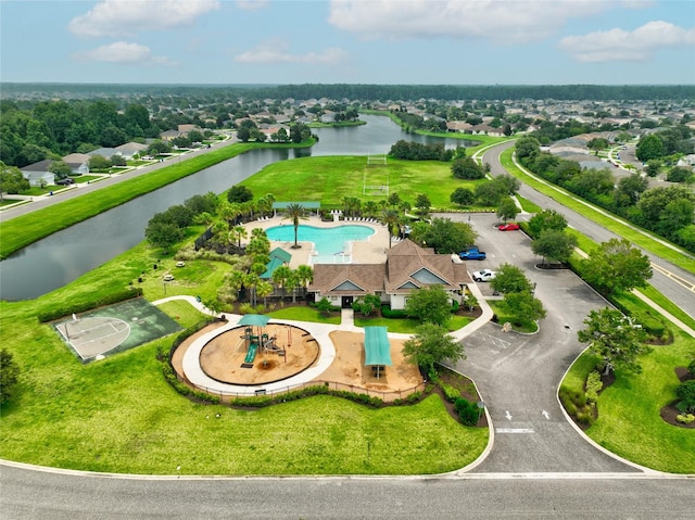 birds eye view of property with a water view