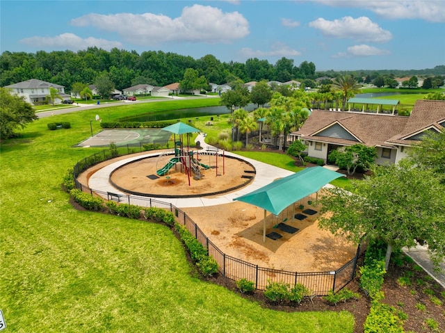 surrounding community featuring a playground and a lawn