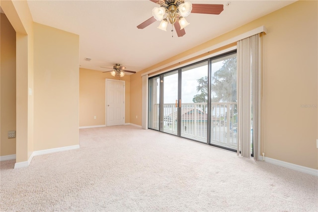 spare room with light carpet and ceiling fan