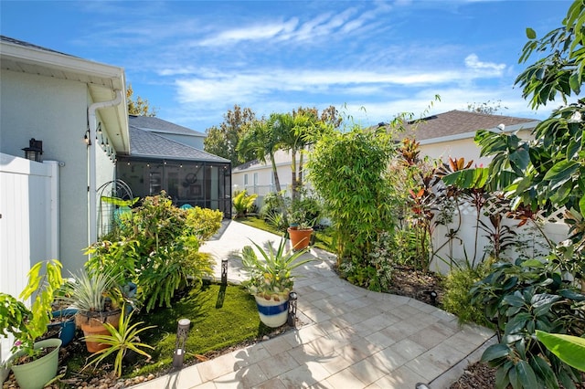 view of patio with a sunroom