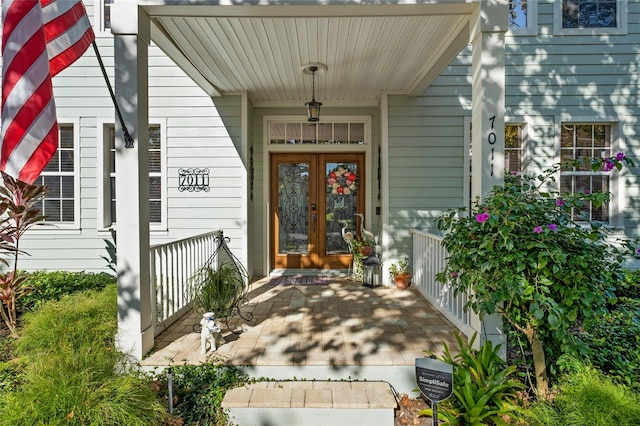 view of exterior entry featuring a porch