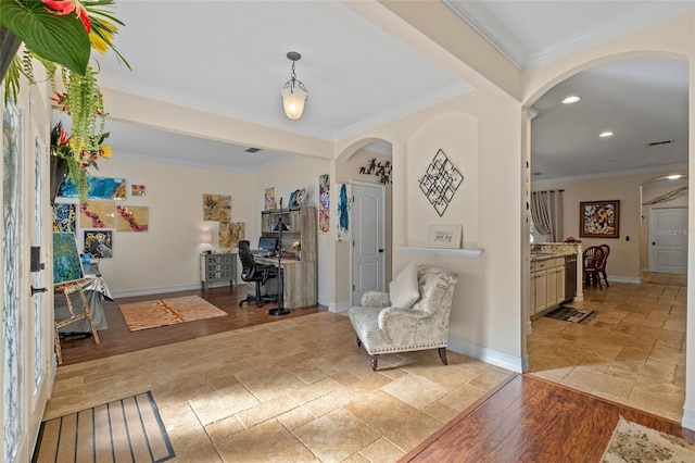 interior space with crown molding and light hardwood / wood-style flooring