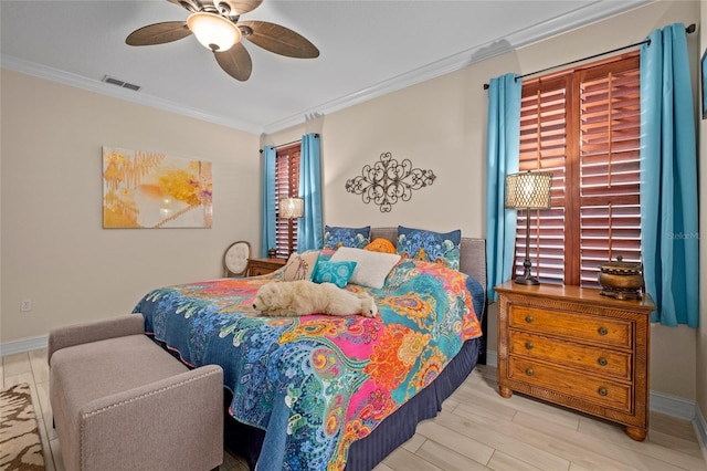 bedroom featuring light hardwood / wood-style flooring, ceiling fan, and ornamental molding