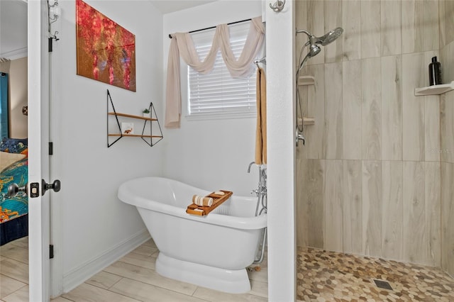 bathroom featuring hardwood / wood-style floors and separate shower and tub