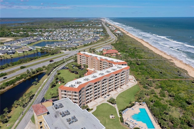 drone / aerial view with a water view and a view of the beach