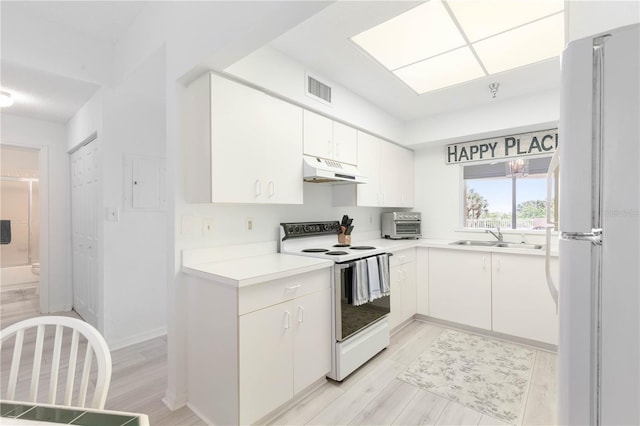 kitchen with white cabinetry, light hardwood / wood-style floors, sink, and white appliances