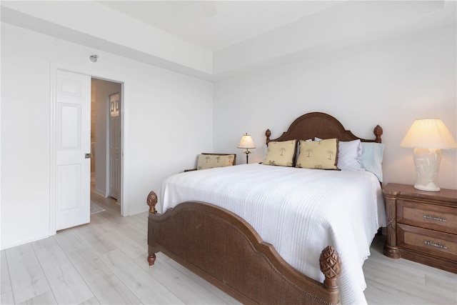 bedroom with light wood-type flooring and ceiling fan