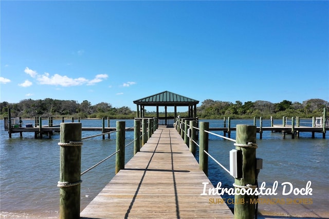 dock area with a gazebo and a water view