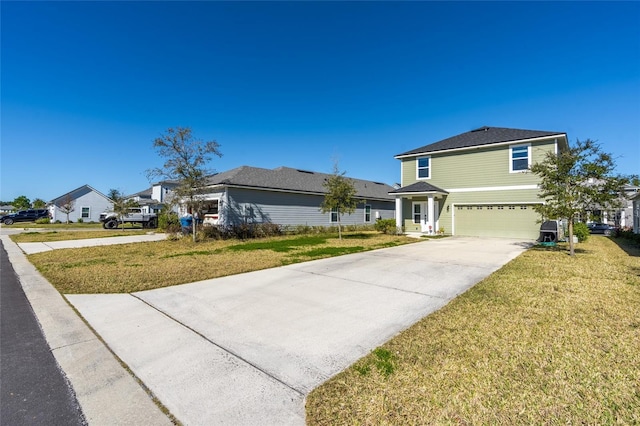 view of front of home featuring a garage and a front lawn