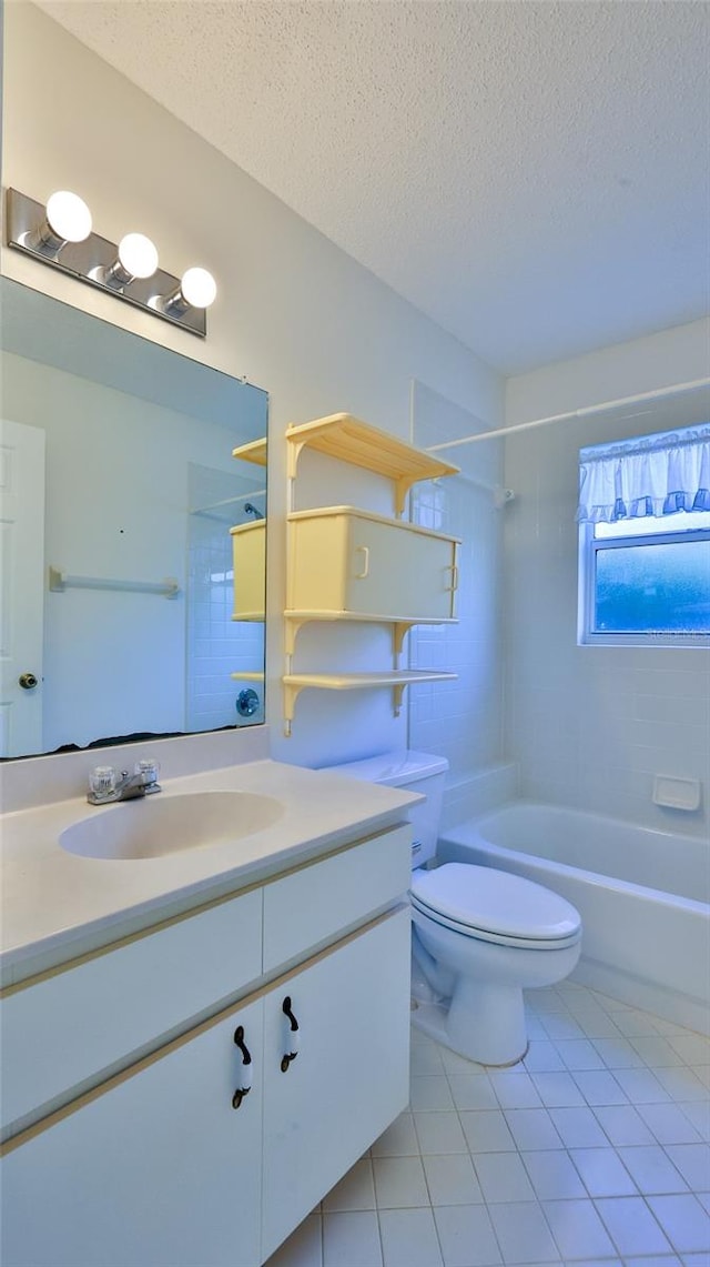 bathroom featuring toilet, tile patterned flooring, tub / shower combination, a textured ceiling, and vanity