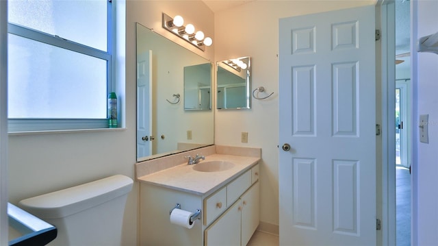 bathroom featuring vanity and toilet