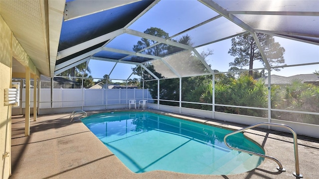 view of swimming pool featuring a fenced in pool, a lanai, and a patio area