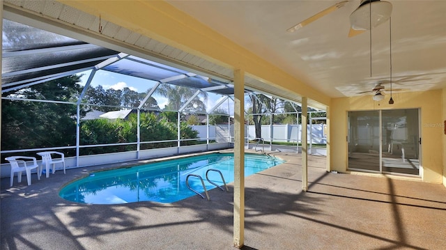 view of swimming pool featuring a fenced in pool, glass enclosure, a patio area, and fence