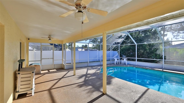 view of pool with a fenced in pool, a patio, ceiling fan, fence, and a lanai