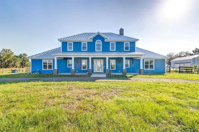 view of front facade with a porch and a front lawn