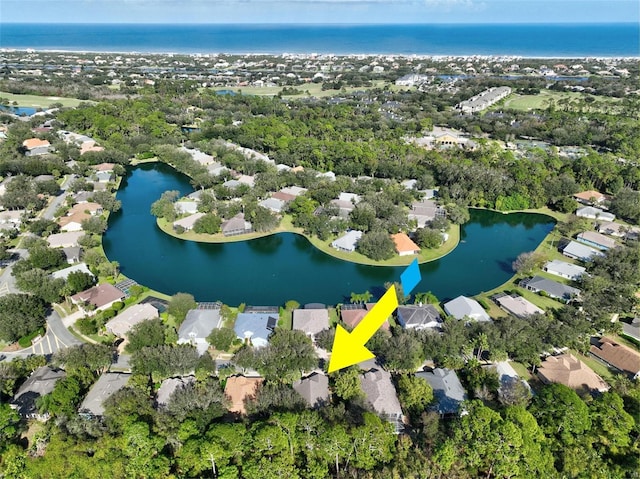 32 Shinnecock Dr, Palm Coast, FL 32137 - aerial overview of property's location with a nearby body of water, nearby suburban area, and a tree filled landscape