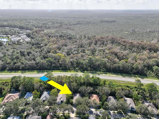 32 Shinnecock Dr, Palm Coast, FL 32137 - aerial view of property and surrounding area with a forest