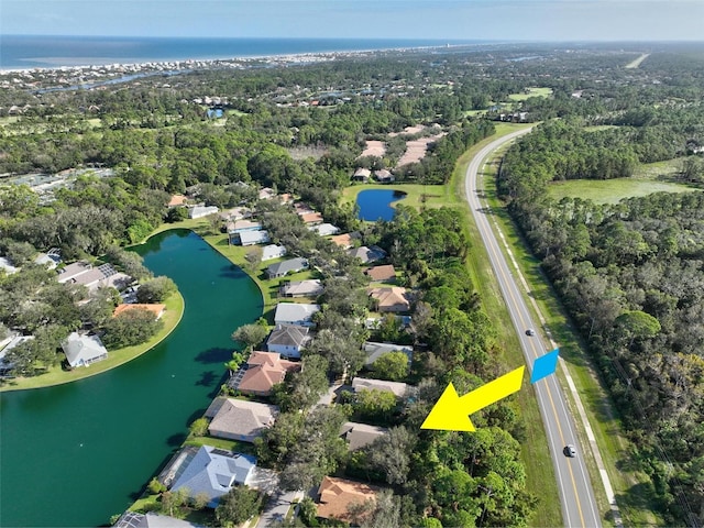 32 Shinnecock Dr, Palm Coast, FL 32137 - aerial overview of property's location with a large body of water and nearby suburban area