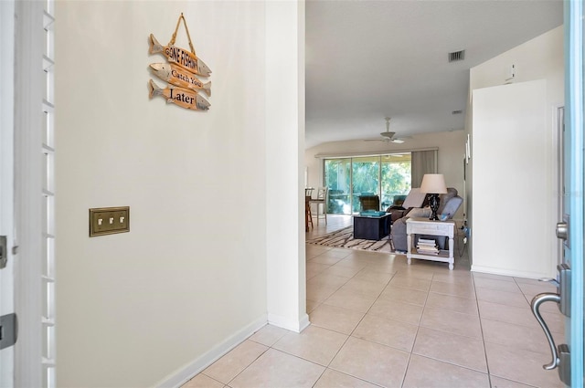 32 Shinnecock Dr, Palm Coast, FL 32137 - hallway featuring light tile patterned flooring and baseboards