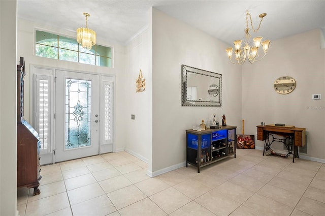 32 Shinnecock Dr, Palm Coast, FL 32137 - foyer entrance with a chandelier, light tile patterned floors, baseboards, and ornamental molding
