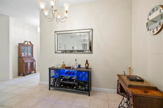 32 Shinnecock Dr, Palm Coast, FL 32137 - bar area featuring a chandelier, tile patterned flooring, and baseboards