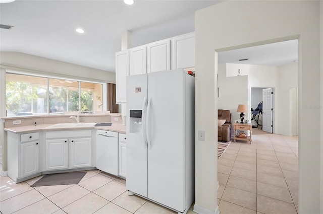 32 Shinnecock Dr, Palm Coast, FL 32137 - kitchen featuring white appliances, a sink, light tile patterned floors, white cabinetry, and light countertops