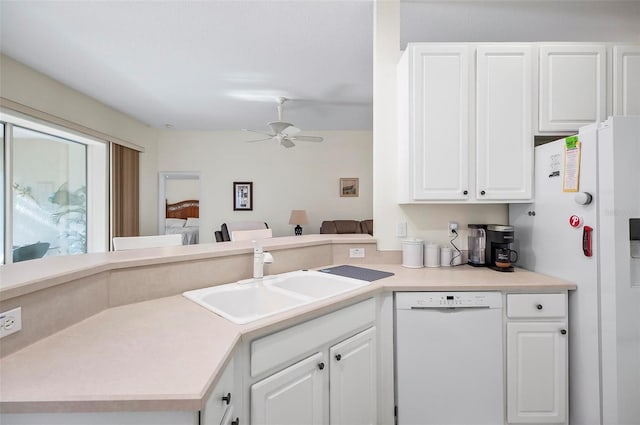 32 Shinnecock Dr, Palm Coast, FL 32137 - kitchen featuring white appliances, a sink, ceiling fan, and white cabinetry