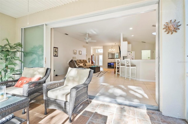 interior space featuring lofted ceiling and ceiling fan