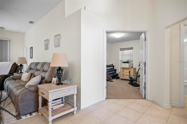 32 Shinnecock Dr, Palm Coast, FL 32137 - corridor with light carpet, light tile patterned floors, and baseboards