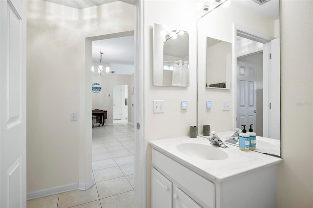 32 Shinnecock Dr, Palm Coast, FL 32137 - bathroom featuring tile patterned floors, vanity, baseboards, and a chandelier